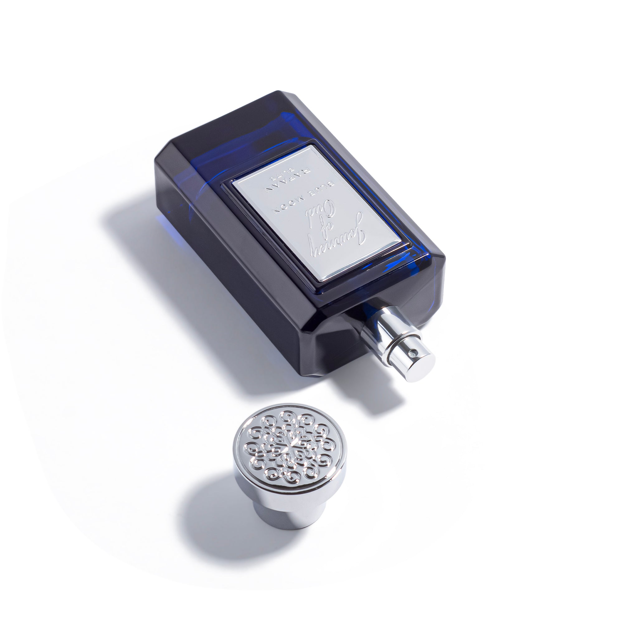Journey of Oud Blue moon perfume bottle with cap on a white background
