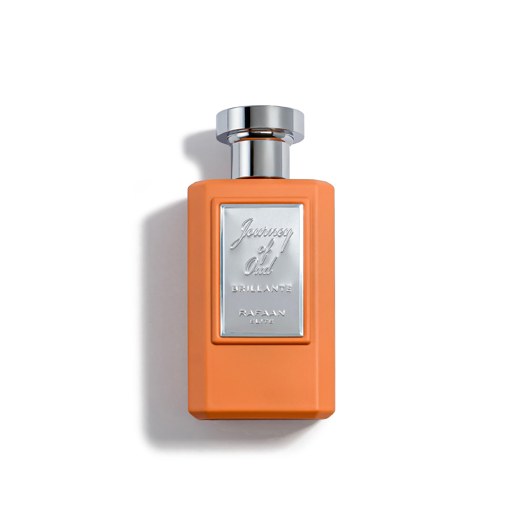 journey of oud brillante Perfume bottle with orange body and silver cap on a white background