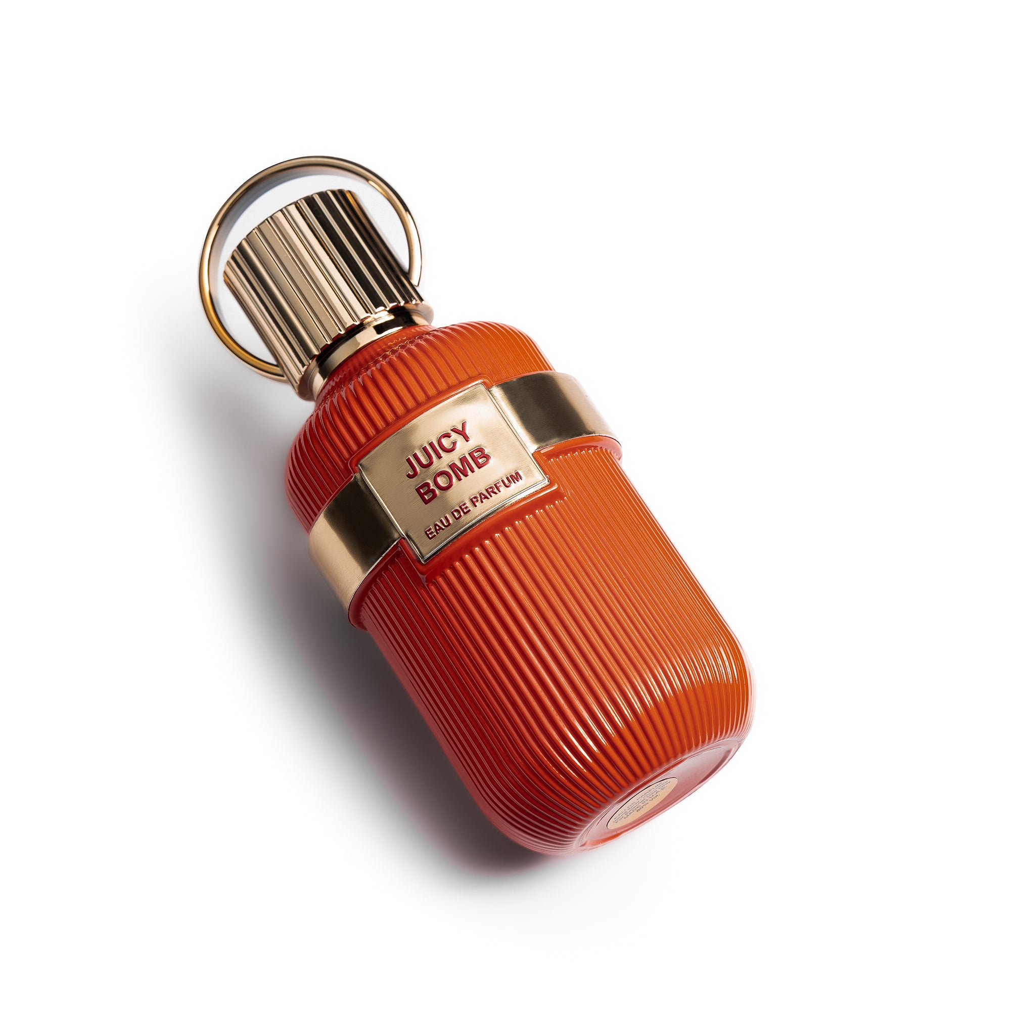 Juicy Bomb Perfume Bottle Lying Down By La Parfum Galleria