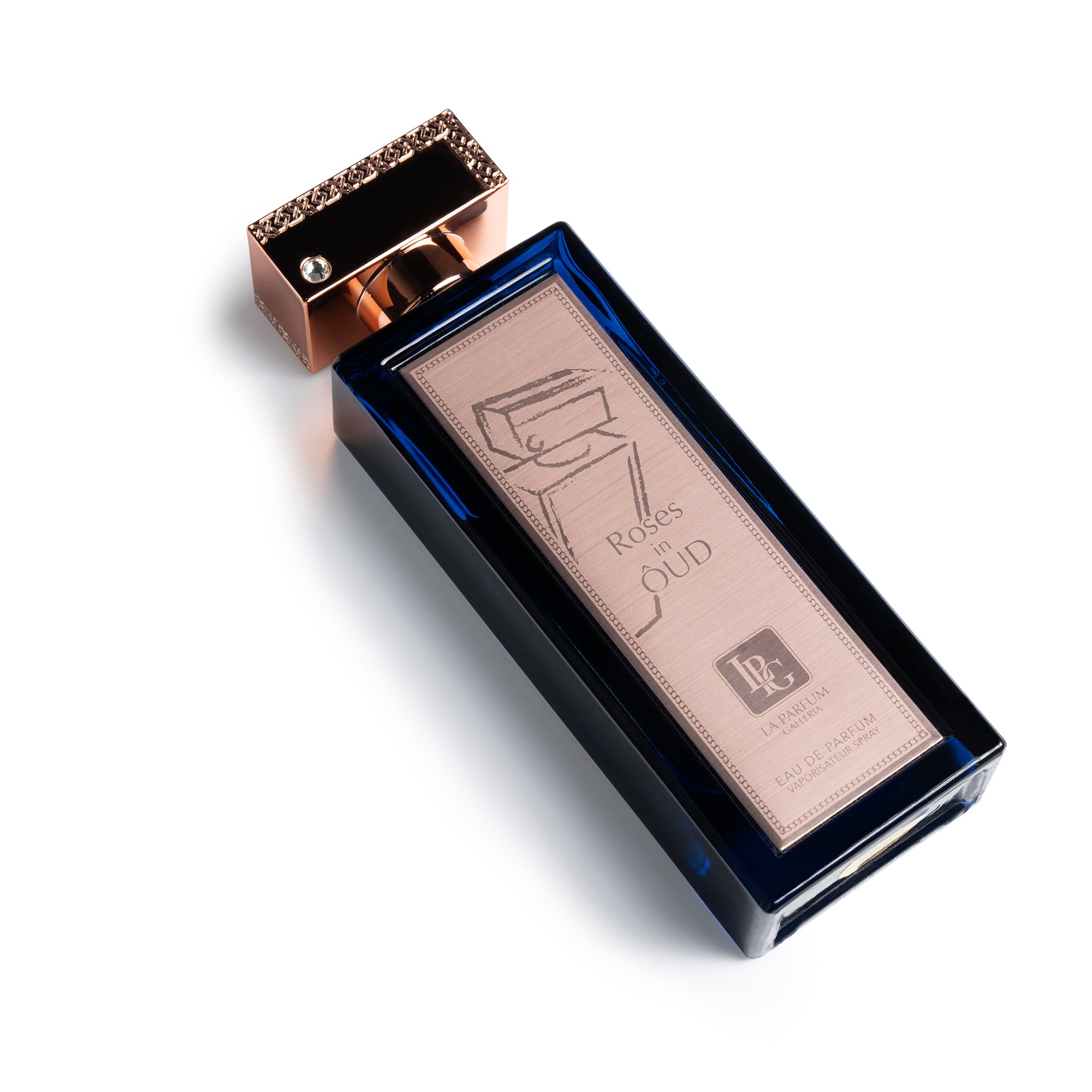 Roses in Oud Perfume Bottle Lying Down By La Parfum Galleria
