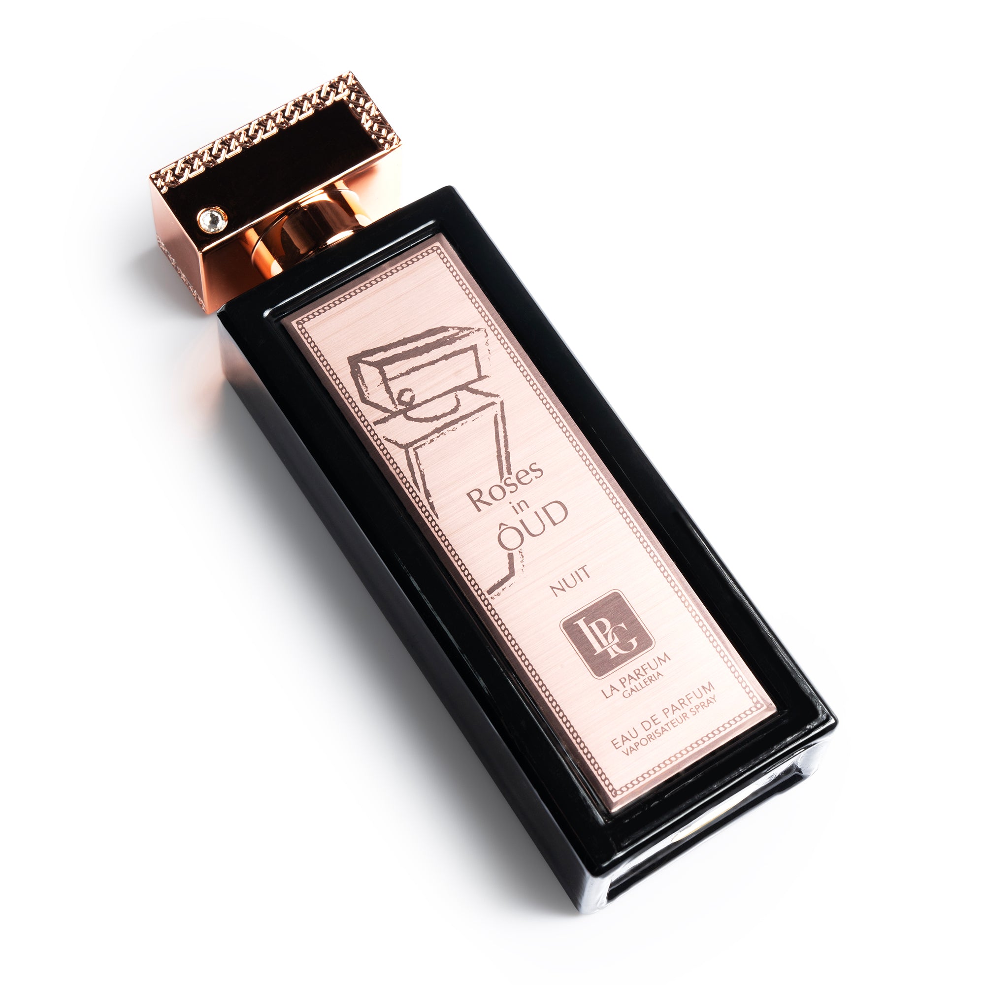 Roses in Oud Nuit Perfume Bottle Lying Down By La Parfum Galleria