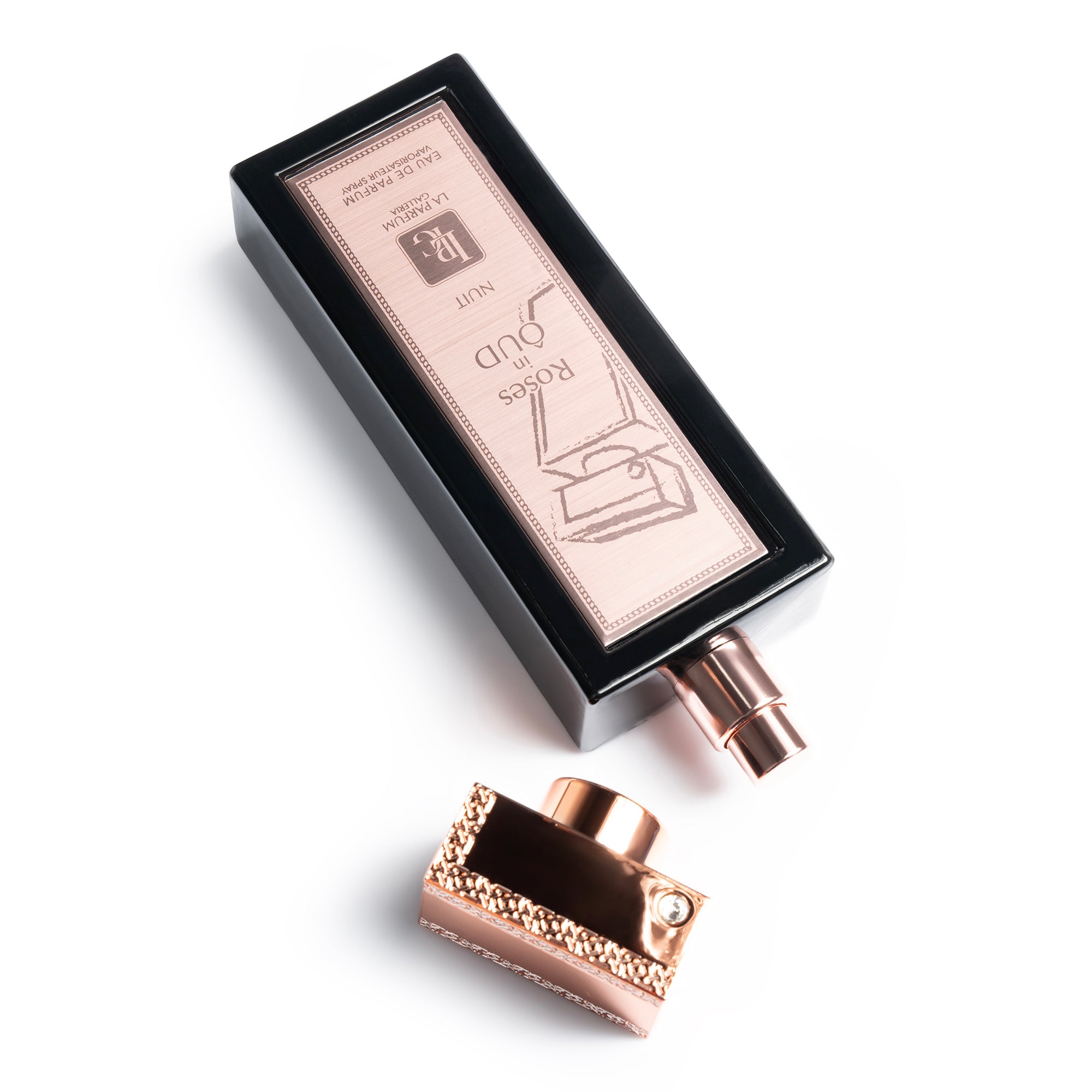 Roses in Oud Nuit Perfume Bottle With Cap off By La Parfum Galleria