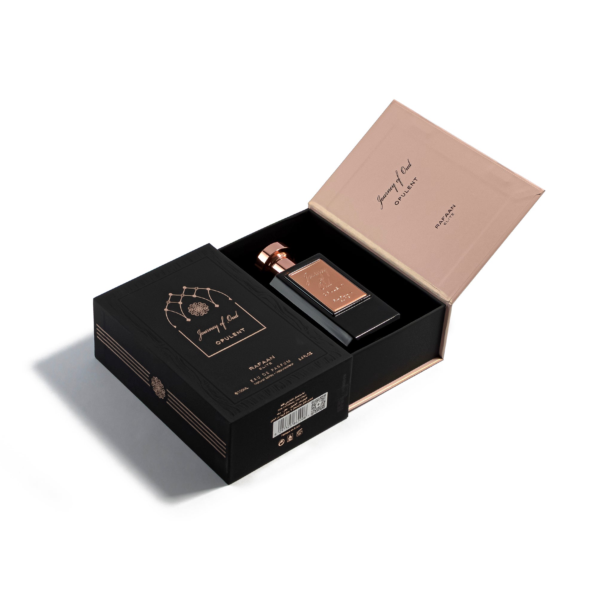 journey of oud opulent Perfume bottle in an open black box with a rose gold lid on a white background