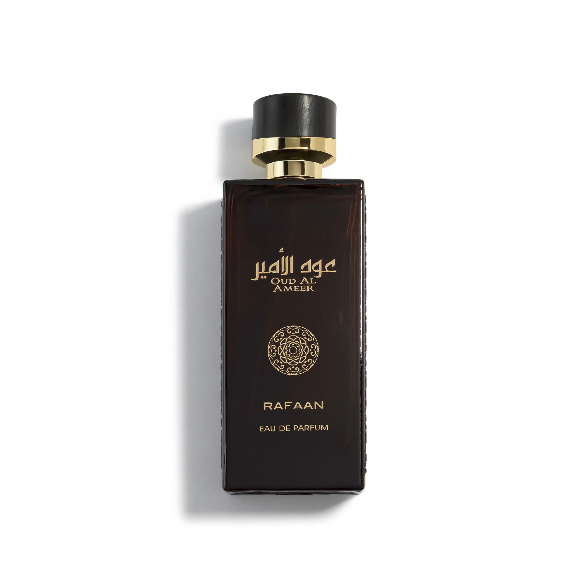 Oud Al Ameer Rafaan Perfume bottle with gold cap and decorative elements on a white background