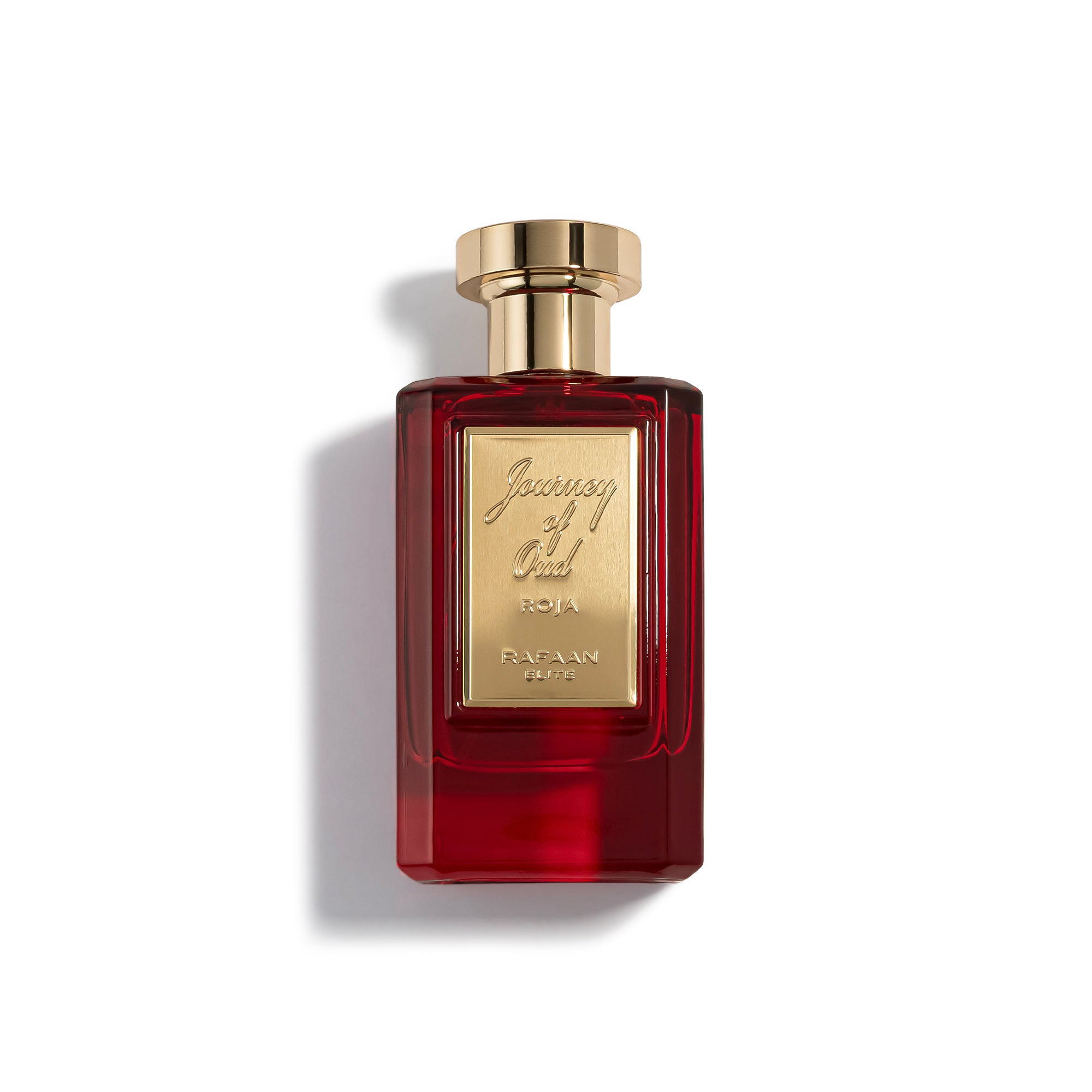 journey of oud roja perfume bottle with gold cap on a white background