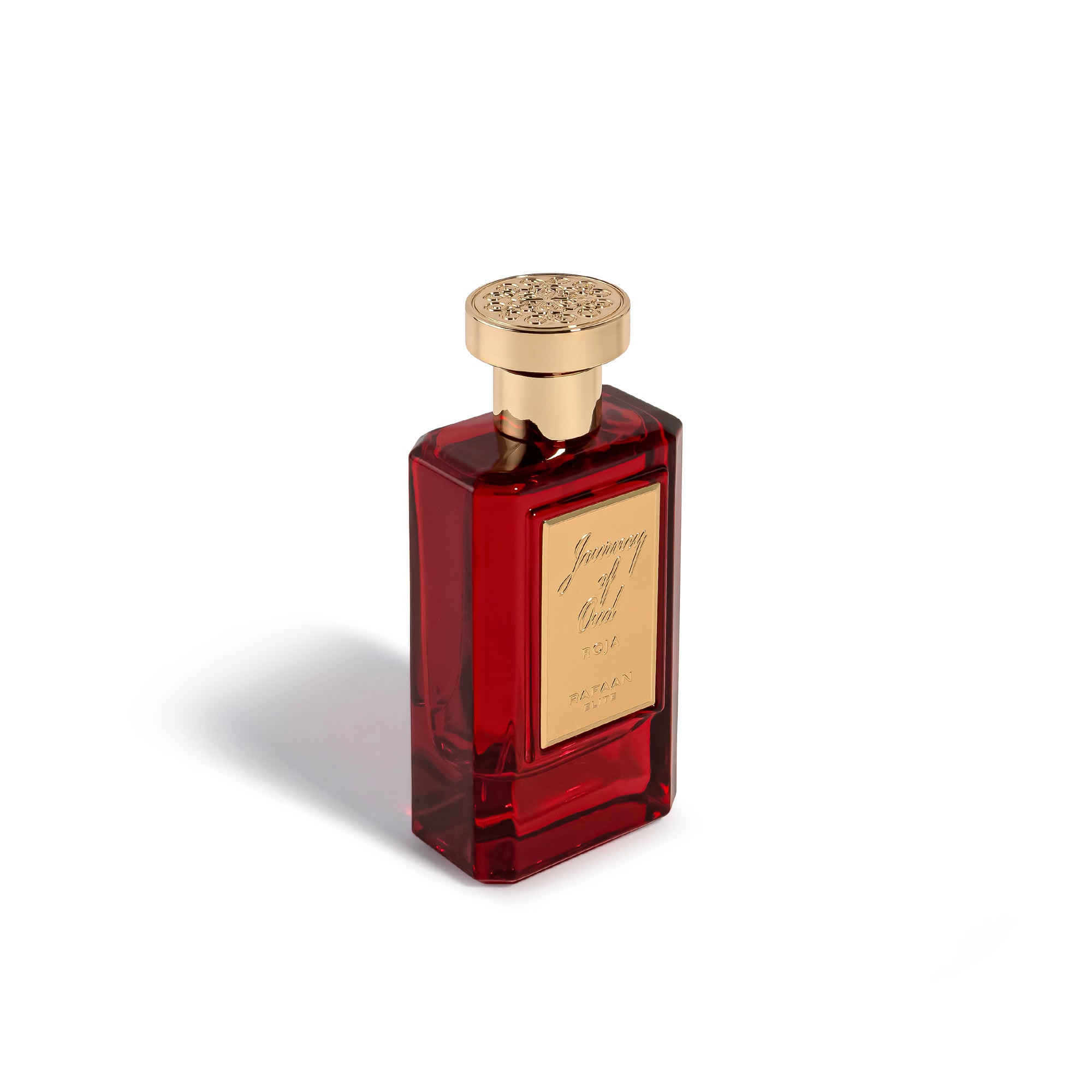 journey of oud roja perfume bottle with gold cap on a white background