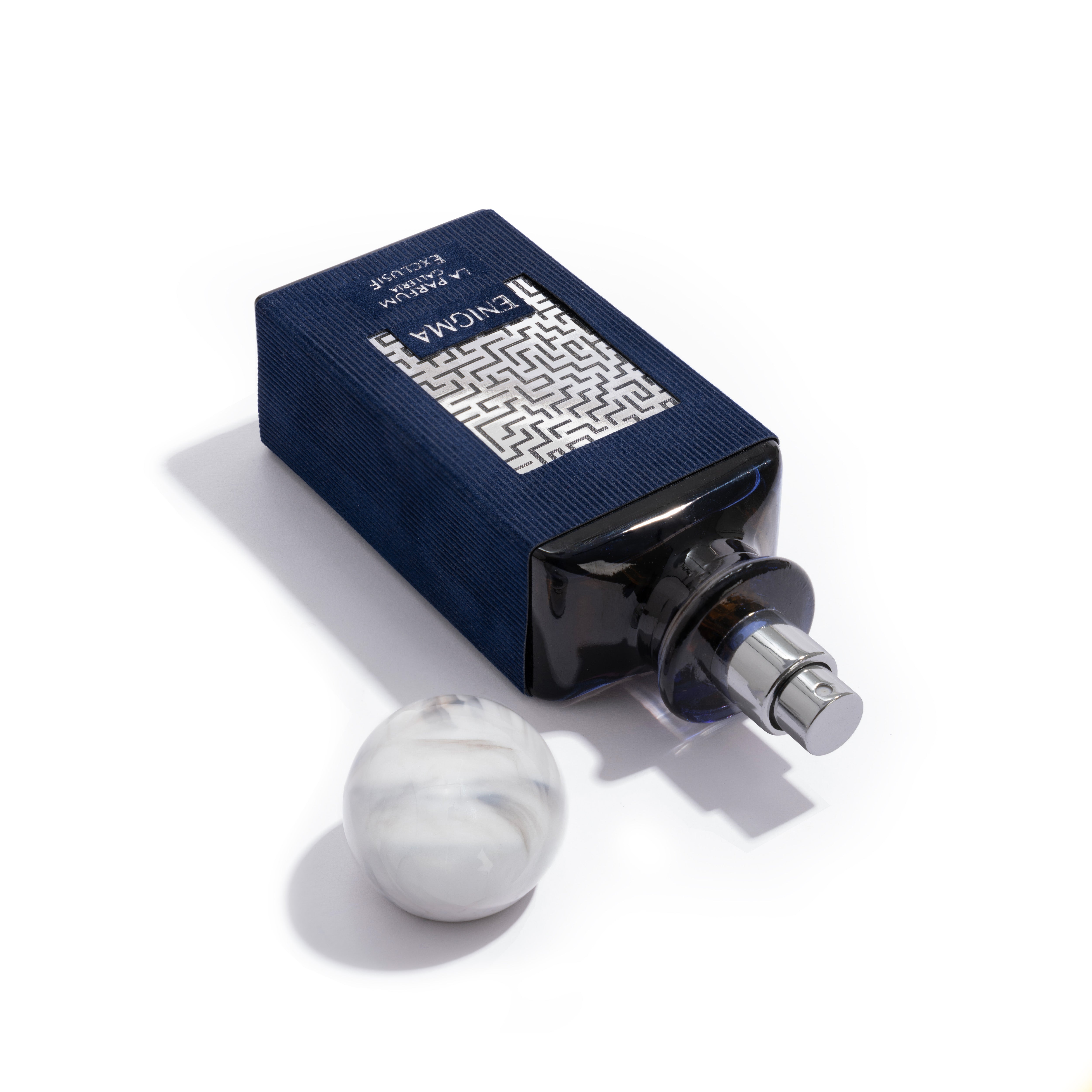 Enigma Perfume Bottle With Cap Off By La Parfum Galleria