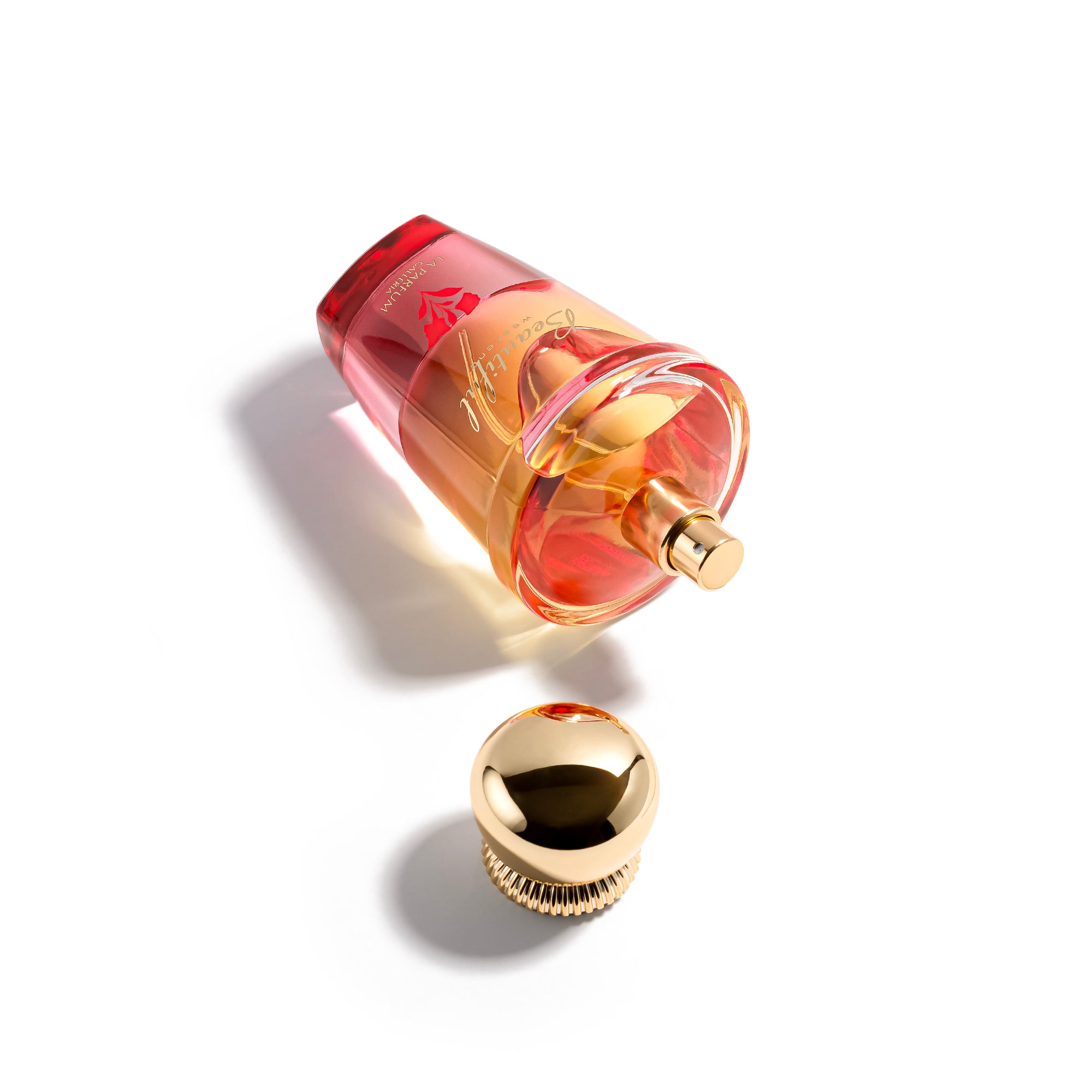 beautiful weekend Perfume bottle with pink and gold design on a white background