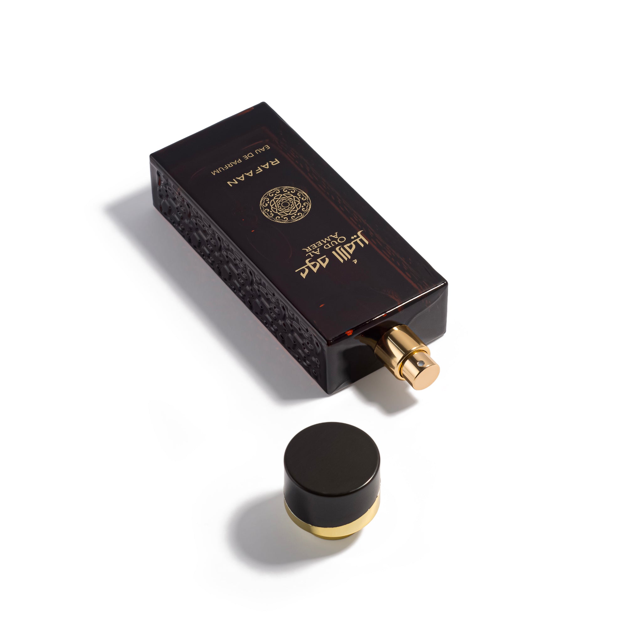 oud al ameer rafaan perfume bottle with decorative cap on a white background